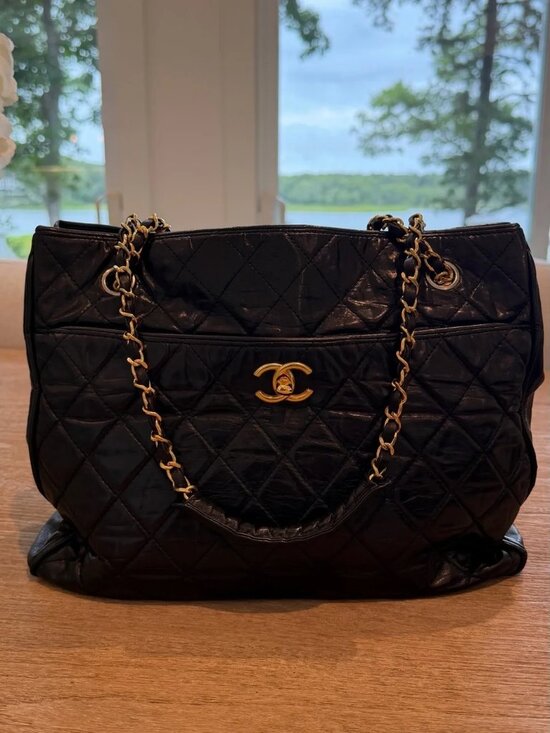 CHANEL Handbags - CHANEL Black Quilted Leather Shoulder Tote with Gold Chain Hardware